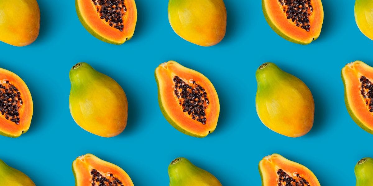 Papaya fruit seamless pattern on blue color background