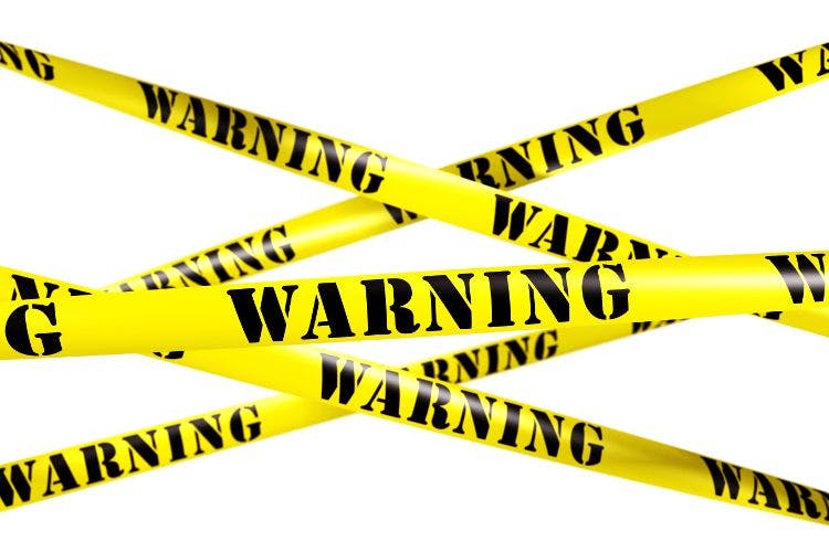caution tape with the word "warning" on it against white background