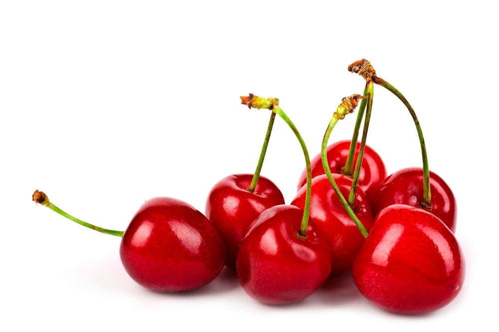 seven cherries on white background