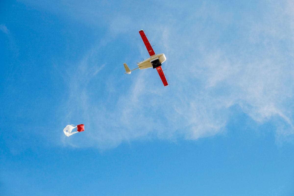 Zipline drone dropping package