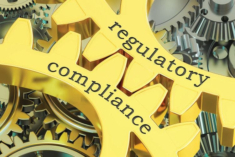 gears that say regulatory compliance