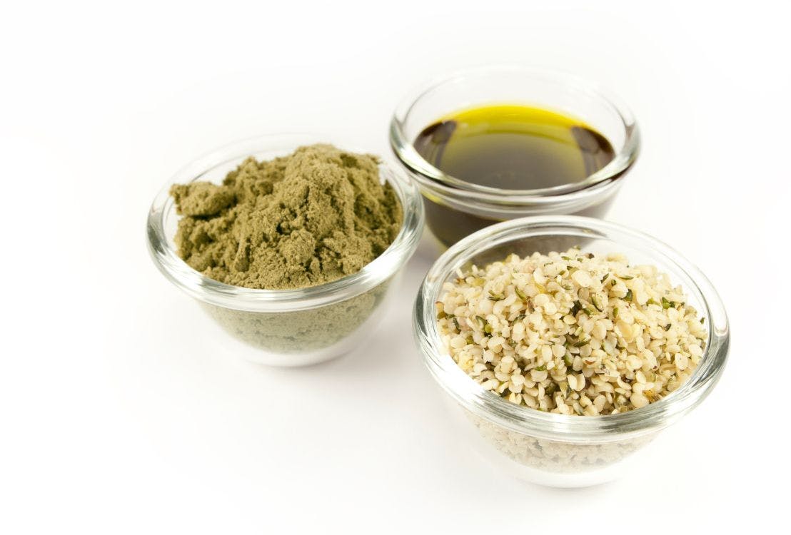 hemp seed, hemp oil, and hemp powder in glass bowls
