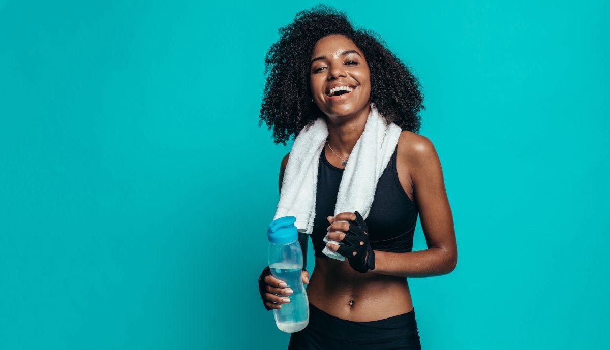 woman happy after exercise on blue background