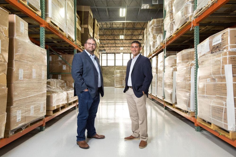 Adam Gershenson (left), director of logistics and fulfillment operations, and Vincent Tricarico (right), executive vice president, both of NutraScience Labs, standing inside the company’s new Hauppauge, NY, distribution center. Photo from NutraScience Labs.
