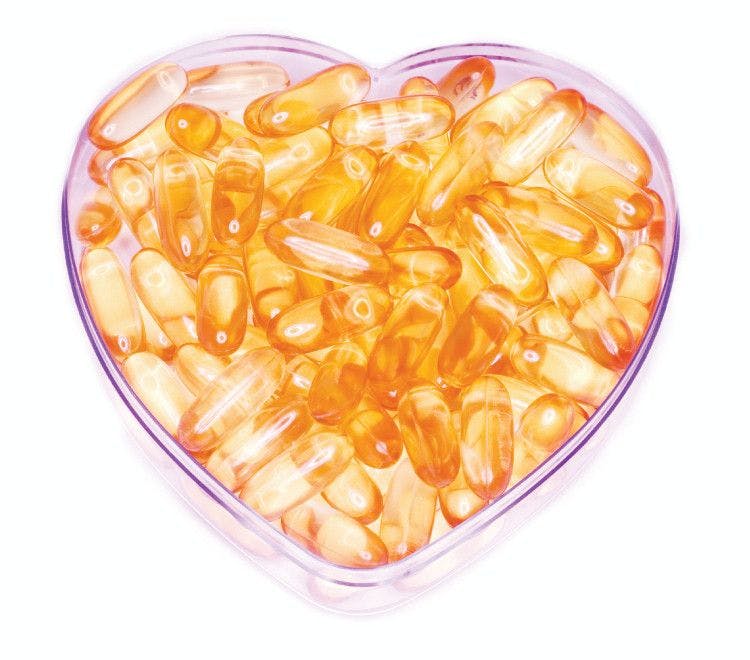 fish oil capsules in heart shaped dish