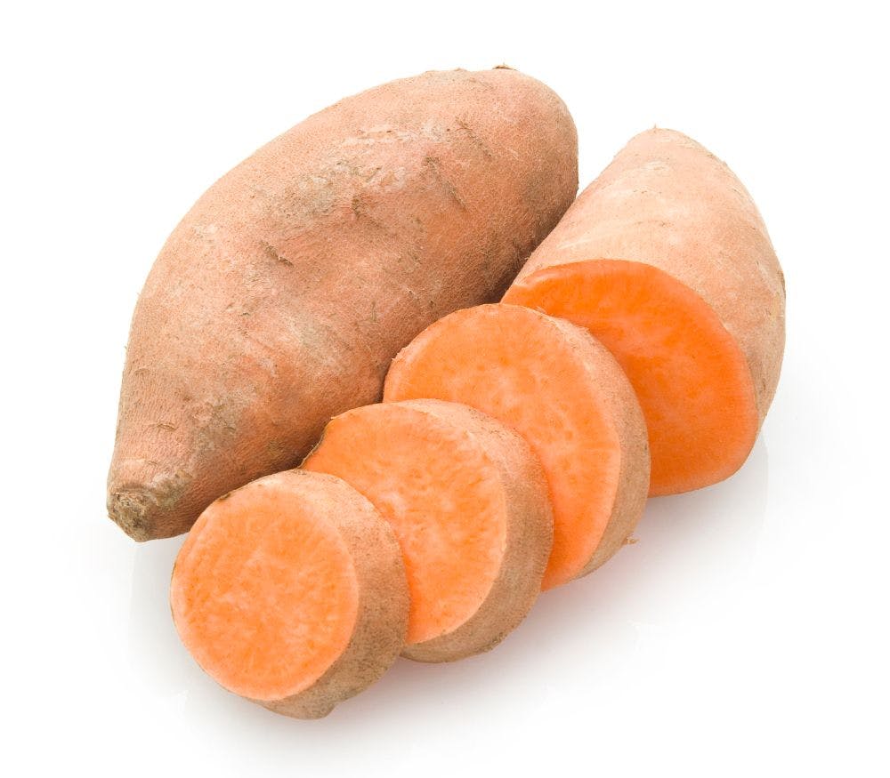 two sweet potatoes, one sliced, one whole