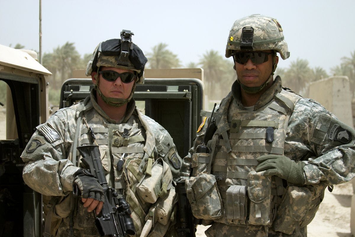 A U.S. Staff Sergeant stands next to his Battalion Commander, a Lieutenant Colonel. Photo © iStockphoto.com/Rockfinder