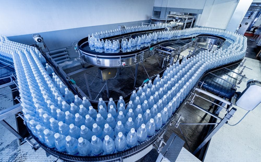 Production line for bottled water. Image courtesy of NJ Labs