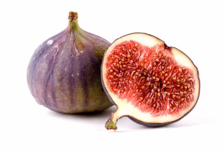 one whole fig and one half fig with interior exposed