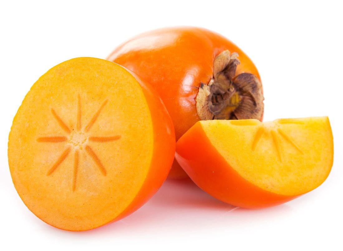 persimmon fruit, one whole, a half and a quarter