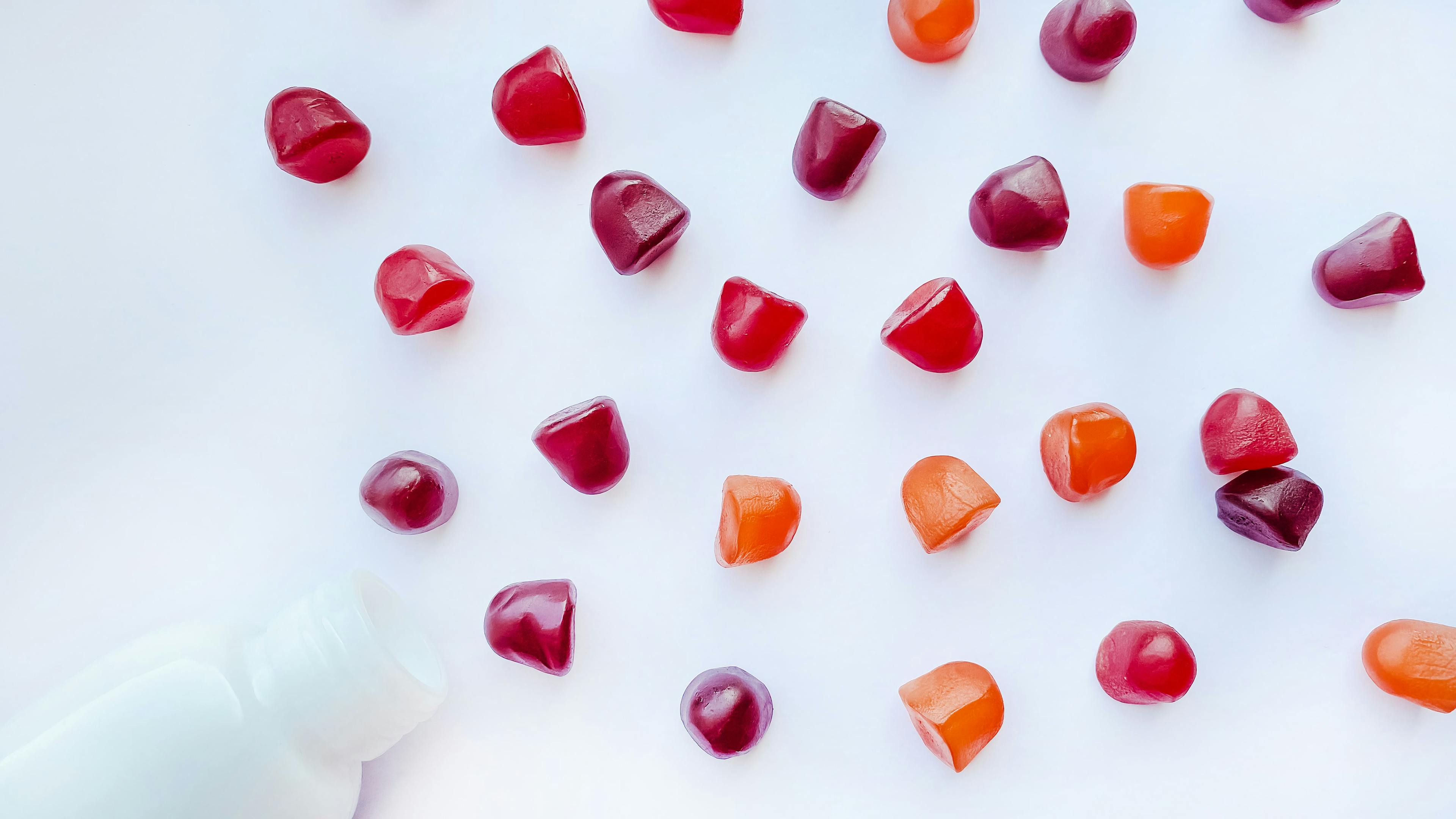 gummies scattered on white background