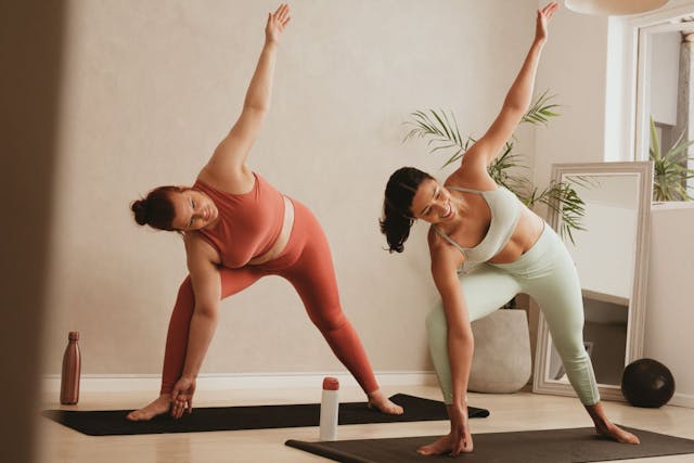 two women doing yoga
