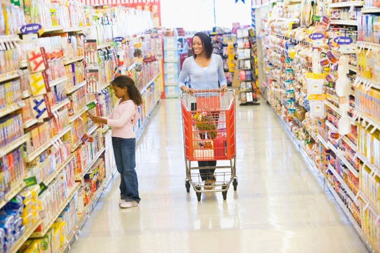 mother and daughter shopping in grocery store